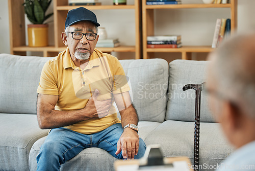 Image of Consulting, doctor and senior man on sofa in therapy with walking stick for counselling discussion with checklist of pain. Elderly patent, talking and therapist for anxiety or mental health service