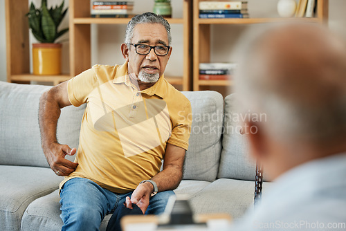 Image of Doctor, consultation and senior man on sofa with walking stick or discussion of pain in physical therapy with checklist. Therapist, consulting and talking elderly patient on couch in rehabilitation