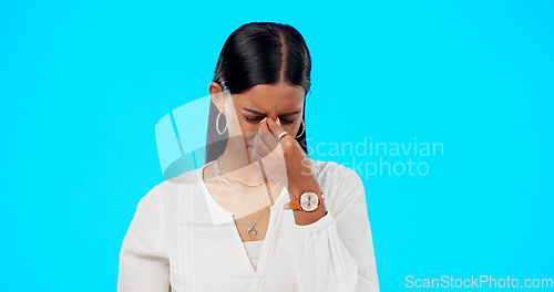 Image of Business woman, headache and eye pain with migraine, allergy and stress in studio. Female professional, health problem and tired from anxiety with mistake, fatigue and work fail in blue background