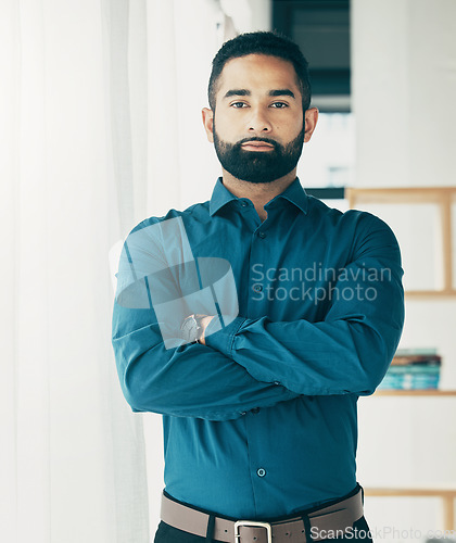 Image of Portrait, serious and business man with arms crossed in office, startup company and workplace for creative career. Face, professional entrepreneur and confident designer, employee or worker in Brazil