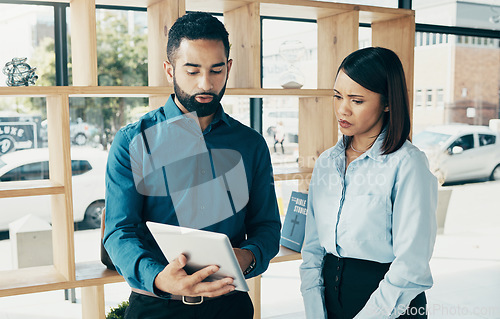 Image of Business, woman and man with tablet for communication, meeting and project management in office. Professional, people and employees with touchscreen for planning, discussion or recruitment at work