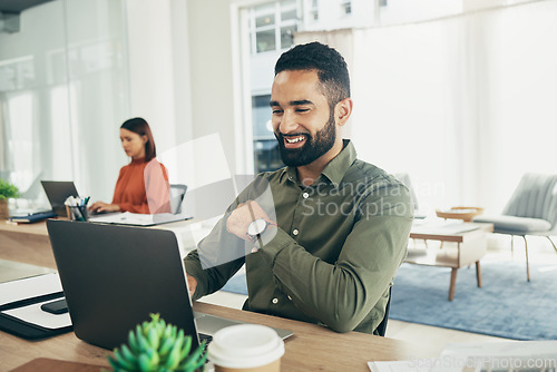 Image of Businessman, smile and working on laptop in office, email or planning a proposal. Happy worker, sitting and reading a review or analyzing on computer, typing and insight for report, strategy and info