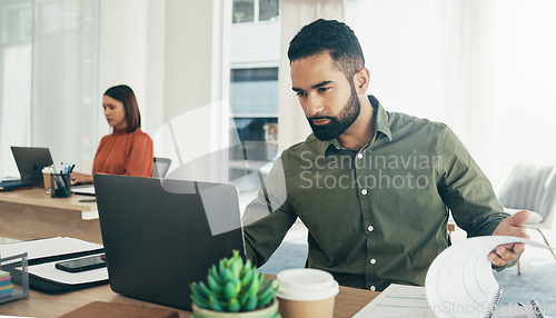 Image of Business man, laptop and documents for finance analysis, budget report and startup revenue or taxes review in office. Professional worker reading computer with accounting paperwork, audit or planning