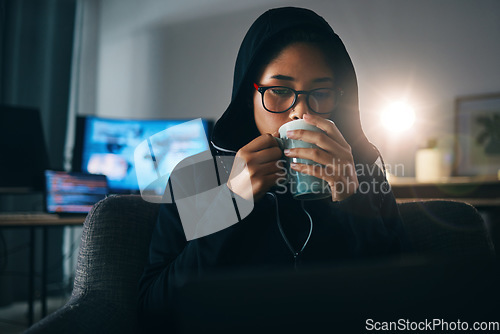 Image of Hacker woman, coffee and night for coding, thinking and ideas for cybersecurity, data phishing and ransomware. Programmer, dark room and sofa to drink matcha for it scam, software or research on web