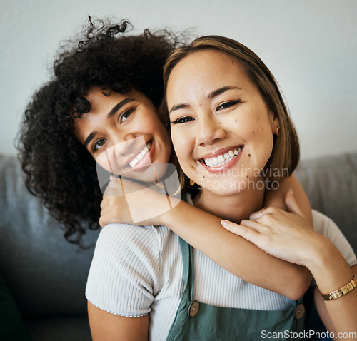 Image of Lesbian, couple and portrait of hug on sofa in home, living room or apartment with love, support and happiness. Lgbt, women or relax together on couch with pride, confidence smile in embrace in house