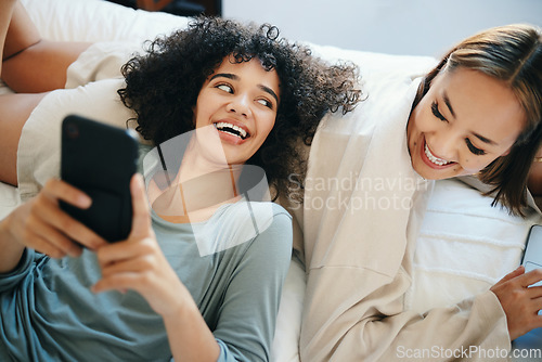 Image of Home, lesbian couple and women with a phone, digital app and typing with social media, relax and romance. Communication, queer people and happy girls with a cellphone, mobile user and meme with post