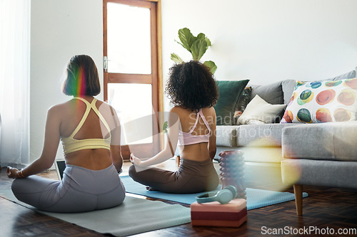 Image of Yoga, meditation and friends in yoga online class in home, living room or women or streaming exercise and workout. Healthy, fitness and training with holistic learning for zen, wellness and peace