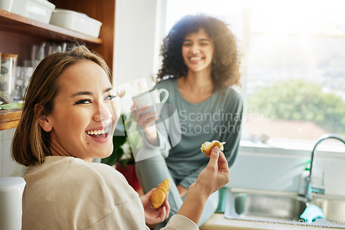 Image of Happy, portrait and a lesbian couple with breakfast in the kitchen for eating, hungry and coffee. Smile, house and gay or lgbt women with food, drink and laughing together for lunch in the morning