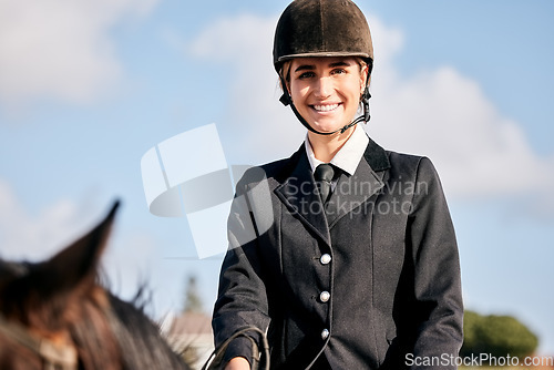 Image of Portrait, horse riding and a woman with an animal on a ranch for sports, training or a leisure hobby. Equestrian, smile or competition and a happy young rider in uniform with her stallion outdoor