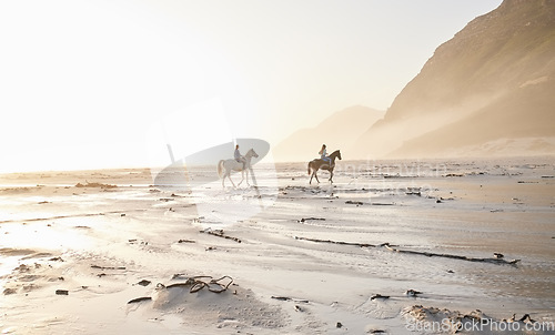 Image of Woman, friends and horse riding for sport at beach with back view while traveling on vacation, trip or wellness. People, together and race for bond, self care and adventure on holiday with sunset
