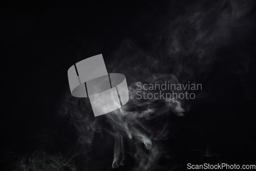 Image of Smoke, black background and mist, fog or gas on mockup space wallpaper. Cloud, smog and magic effect on dark backdrop of steam with abstract texture, pollution pattern or incense vapor moving in air