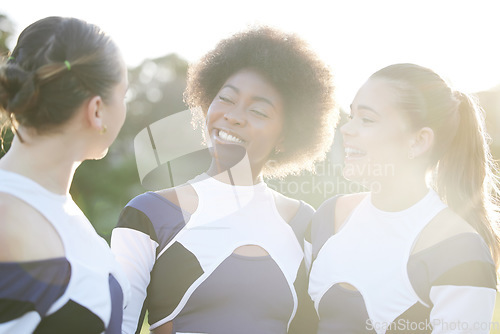 Image of Cheerleader, sports and women on field smile for performance, dance and motivation for game. Teamwork, dancer and people in costume cheer for support in match, competition and sport event outdoors