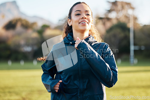 Image of Fitness field, wellness and woman running for outdoor exercise, cardio workout or training for marathon race. Sports warm up, nature sunshine and morning runner doing athlete challenge on grass pitch