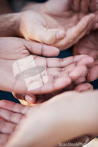 Image of Hands open together, solidarity and community of charity, support or kindness with gratitude. Group of people with palm up, trust and care in helping hand, volunteering and hope for global diversity.