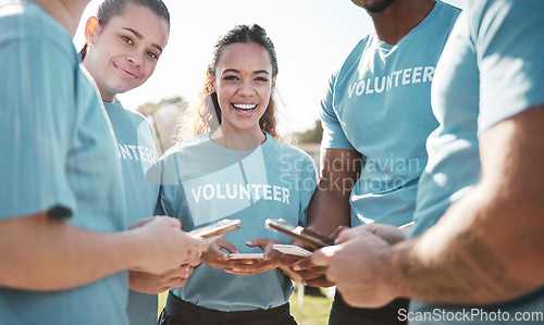 Image of Volunteer, park and portrait of people with phone for social media, online chat and charity website update. Community service, teamwork and happy ngo group on smartphone outdoor for cleaning litter