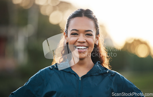 Image of Woman coach, sports and portrait in field, smile and excited for teaching, fitness and wellness in summer. Training mentor, happy and outdoor for exercise, workout or athlete development in sunshine