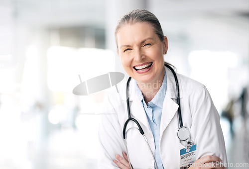 Image of Stethoscope, senior laughing and woman doctor with healthcare, medical work and hospital job. Wellness, heart cardiology and clinic with a female professional with funny joke and happy with career