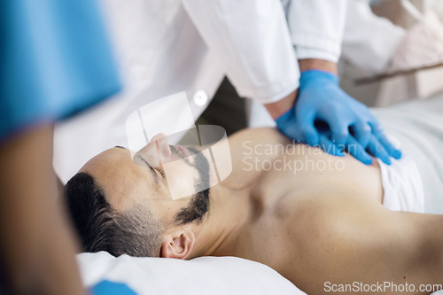 Image of CPR, emergency and hands doctor with man in hospital for medical service, first aid and surgery. Healthcare, team and chest compression on patient for injury, serious accident and wellness in clinic