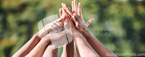 Image of People, teamwork and high five in nature, support or collaboration for motivation or outdoor goals. Closeup of group hands together in team building, solidarity or trust in unity or community outside