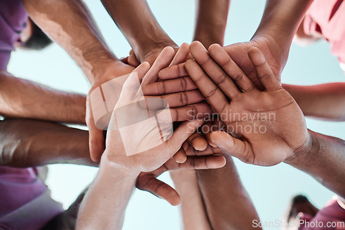 Image of People, teamwork and hands together in collaboration, goals or community for motivation below. Closeup of group piling in team building, solidarity or trust in support for sports, rugby or match