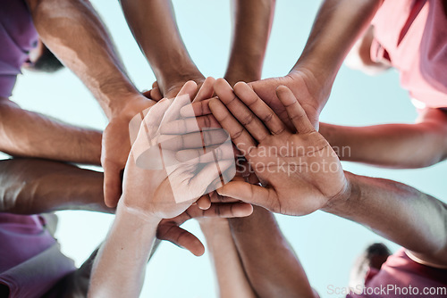 Image of People, teamwork and hands together in sports collaboration, goals or community for motivation below. Closeup of group piling in team building, solidarity or trust in support for rugby game or match