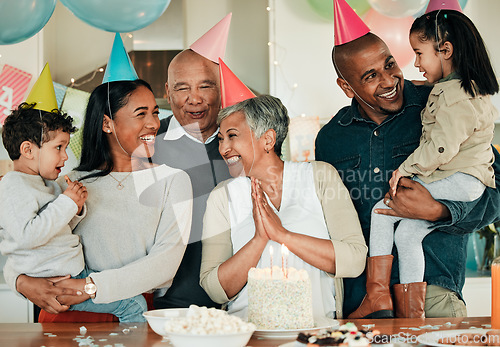 Image of Happy birthday, grandma or family in home for celebration, bond or growth together. Smile, hat or excited grandparents with cake, love or children siblings in a fun house party or special event