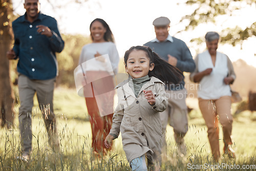 Image of Park, running and girl with parents or grandparents on grass field for freedom, adventure or playing in summer. Family, men or women with fun or love in forest with sunshine for care or happiness