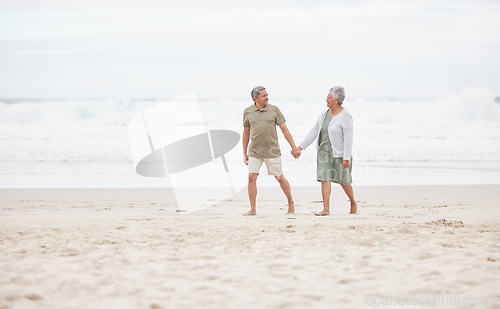 Image of Senior, couple and hand holding on the beach for retirement vacation, holiday or adventure in summer. Elderly, man and woman for walking by ocean or sea with journey and happiness for relax and love