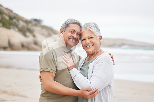 Image of Senior, couple and hug with portrait on beach in nature together for support, relax and connection with smile. Commitment, man or woman with love embrace for peace, trust and vacation at ocean or sea
