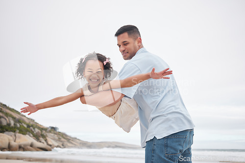 Image of Beach, airplane and girl child with father in nature happy, bond and having fun together. Flying, freedom and face and kid with parent at the ocean with love, support and games, care or trust outdoor