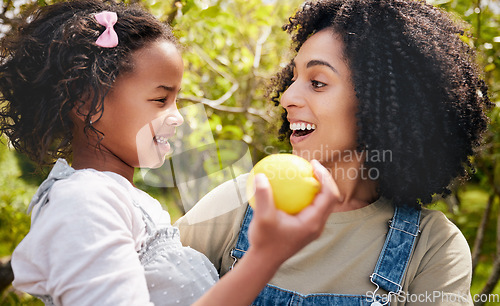 Image of Happy, lemon and mother with girl, outdoor and happiness with hug, excited and bonding on vacation. Family, mama and kid with mom, child and fruit with a smile, citrus and nutrition with break or joy