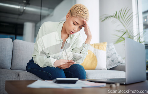 Image of Woman, headache and stress for money, home budget or income on sofa with inflation, rent or bills. African person with depression, sad or confused for laptop cash debt, loan payment or cost of living