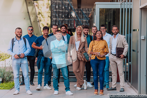 Image of A diverse group of businessmen and colleagues walking together by their workplace, showcasing collaboration and teamwork in the company.