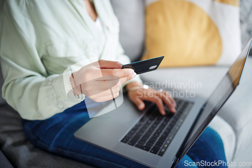 Image of Hands, laptop and credit card for home online shopping, fintech payment and e commerce on sofa. Closeup of person typing on computer for internet banking, website subscription or application for loan