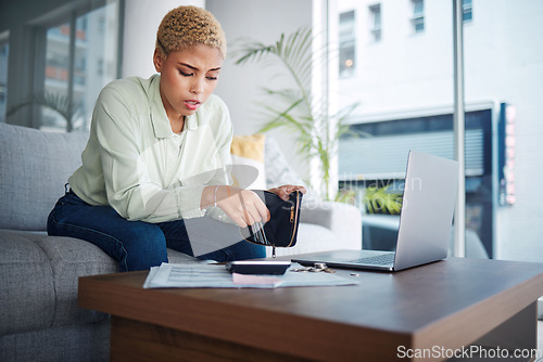 Image of Home, finance and woman with a laptop, stress and calculator with budget planning, review finances and inflation. Person, paperwork and girl on a sofa, pc or counting with wallet and bankruptcy