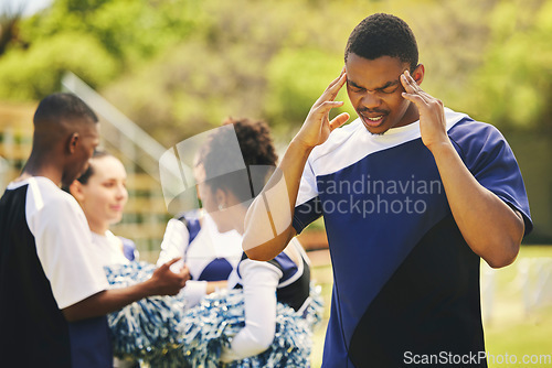 Image of Cheerleader, fitness injury and man headache from sport, training and cheer exercise on a grass field. Stress, accident and burnout outdoor with migraine pain and workout challenge for wellness