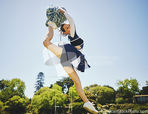 Image of Fitness, jump and woman cheerleader on a field for motivation or support practice with team. Sports, cheerleading and female athlete training for skill and dance with energy at competition or match.