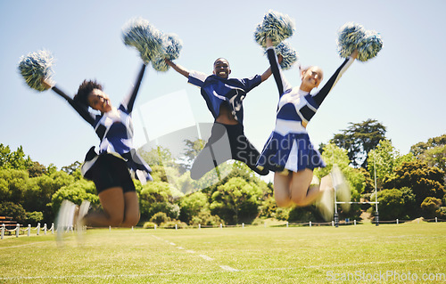 Image of Cheerleader team, smile and people jump for performance on field outdoor in training, celebration or exercise. Happy, cheerleading group and energy for support at event, sport competition and blur