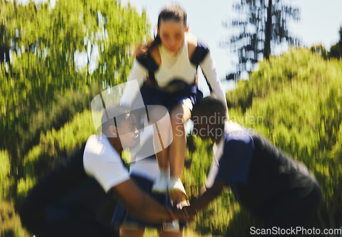 Image of Teamwork, lift or girl cheerleader training in fitness workout, exercise or learning routine on field. Jump, blur or sports woman in group for motivation, inspiration or support on college campus