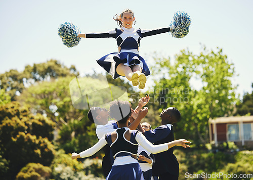 Image of Teamwork, air or girl cheerleader training in fitness workout, exercise or learning routine on field. Jump, dance or sports woman in group for motivation, inspiration or support on college campus