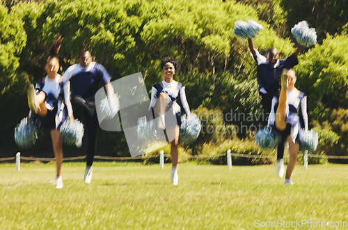 Image of Motion blur, support and a cheerleader group of young people outdoor for a training routine or sports event. Energy, teamwork and diversity with a happy cheer squad on a field together for motivation