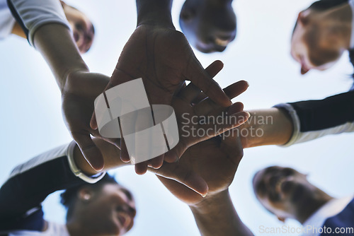 Image of Cheerleader, hands or people in huddle for motivation with support, hope or goal in game on field. Teamwork, low angle or group of sports athletes cheerleaders with pride, plan or solidarity together