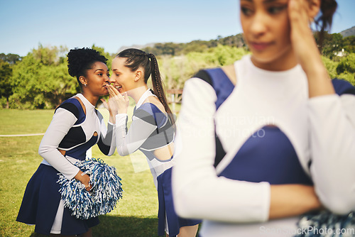 Image of Bullying, cheerleading and friends with gossip about girl, talking behind back and secret. School, psychology and students speaking about teenager with rumor, problem or conversation as cheerleaders