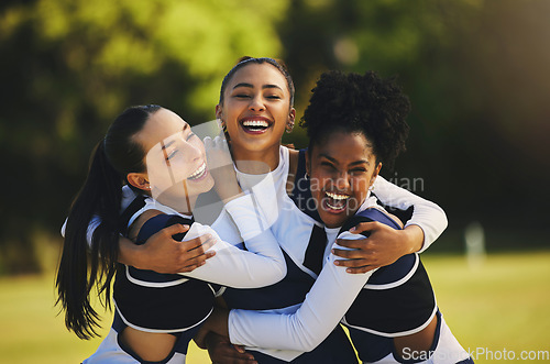 Image of Teamwork, hug or portrait of cheerleader with people outdoor in training or sports event together. Celebrate, smile or proud girl by a happy cheer squad group on field for support, winning or fitness