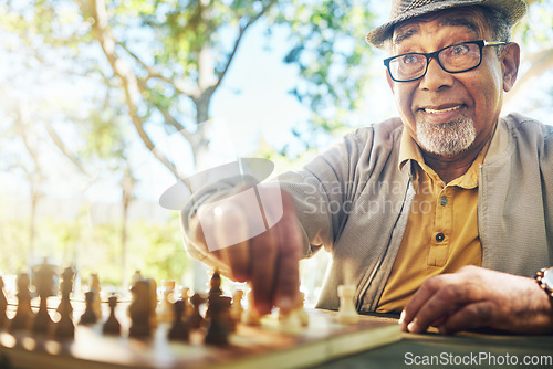 Image of Elderly man in park, hand and chess game strategy, competition or challenge, retirement and moving piece. Closeup, planning and contest outdoor, concentration on boardgame and excited in nature