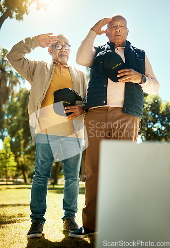 Image of Men, salute and tombstone for respect in cemetery for military, navy or memorial with grief, support or empathy. Elderly friends, gravestone and hats off with sign, memory and love for fallen soldier