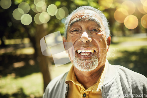 Image of Senior man, portrait and bokeh in nature, garden or park with freedom, confidence and wellness in retirement. Happy, face and elderly smile with pride in backyard, environment or holiday in summer