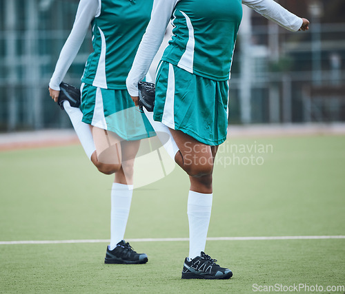 Image of Team, stretching legs and exercise on field, sports and uniform for match, balance and teamwork together. Training with athletes, outdoor and fitness to prepare for game, workout for performance