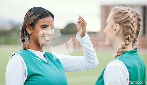 Image of Youth, teenager and girl with smile for sports with team, practice or match on field. Female, person or student with friend in excitement, happiness or joy for game, competition or training at school