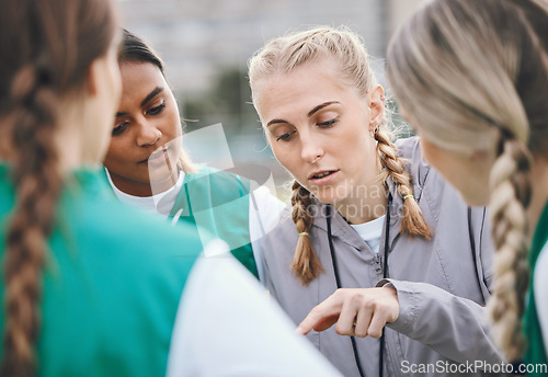 Image of Leader, sports coach or team planning tactics or strategy in a hockey training game, conversation or match. Women, talking or athletes in practice for fitness exercise together for teamwork in group